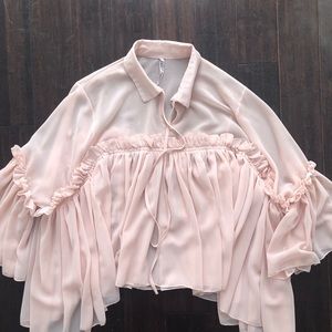 Pink ruffled blouse